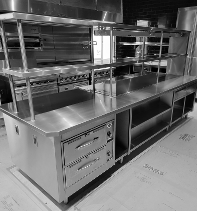 Stainless steel worktables and commercial sinks